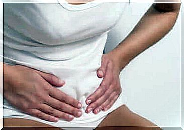 A woman having a stomach ache.