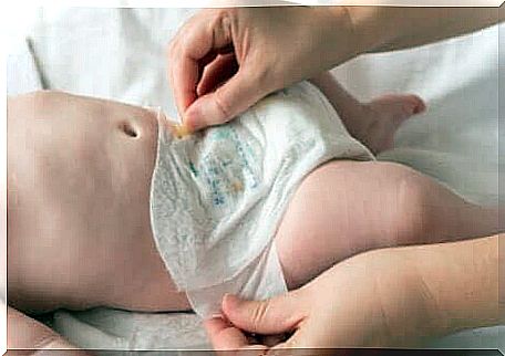 Diaper change of a newborn baby. 