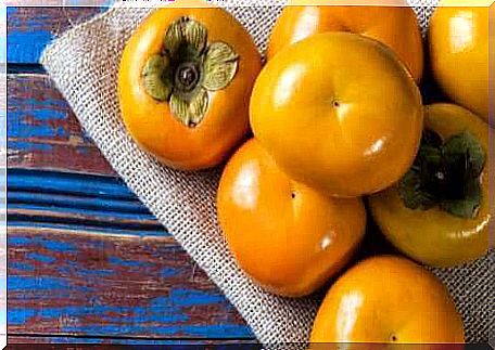 Persimmons on a table.