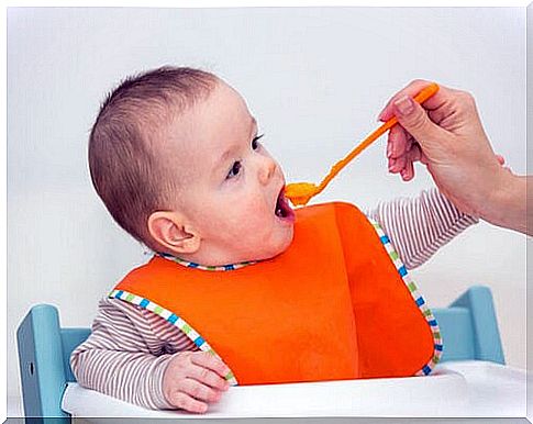 baby eating homemade compote