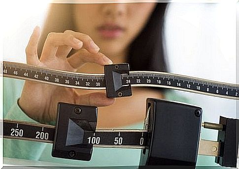 woman weighing herself 